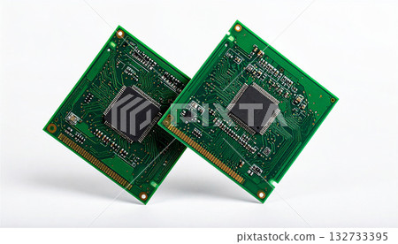 Two electronic circuit boards and microchips arranged on a white background, technology concept representing CPUs and semiconductors 132733395