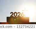 New Year's sunrise in 2026, with the bright rising sun and the Holy Cross of Jesus Christ and the Bible in the background. 132734221