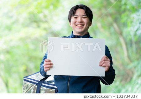 Delivery person with a cooler bag Delivery person with a cooler bag 132734337