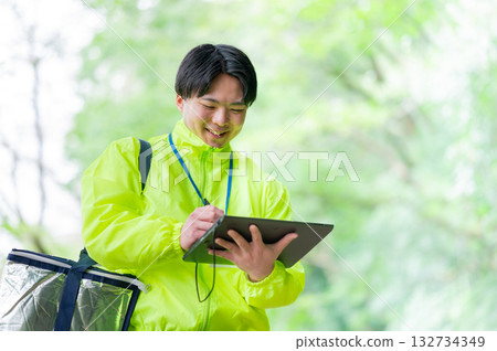 Delivery person with a cooler bag Delivery person with a cooler bag 132734349