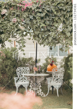 Chair surrounded by flowers 132734381