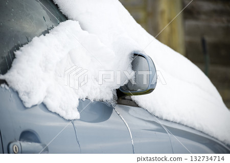 Snow Covered Car With Frosted Window And Side Mirror In Winter Parking Area 132734714