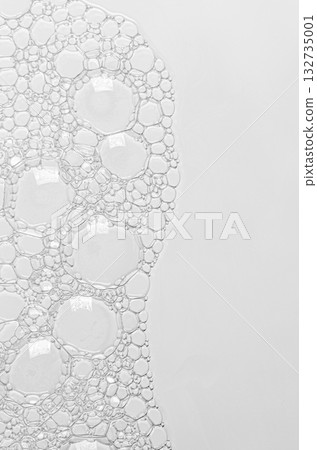 The texture of the foam of shower gel or soap suds or shaving foam. Macrophotography. Copy space 132735001