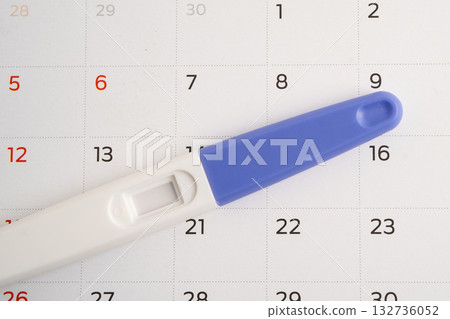 Pregnancy test and birth control pills on calendar, contraception health and medicine. Pregnancy test and birth control pills on calendar, contraception health and medicine. 132736052