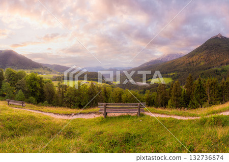 Meadow with road and bench during sunset in Berchtesgaden National Park Meadow with road and bench during sunset in Berchtesgaden National Park 132736874