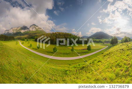 Meadow with road and bench during sunset in Berchtesgaden National Park Meadow with road and bench during sunset in Berchtesgaden National Park 132736879