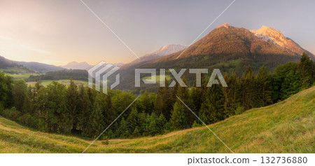 Meadow with road and bench during sunset in Berchtesgaden National Park Meadow with road and bench during sunset in Berchtesgaden National Park 132736880