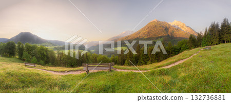Meadow with road and bench during sunset in Berchtesgaden National Park Meadow with road and bench during sunset in Berchtesgaden National Park 132736881