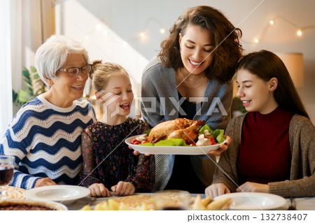 Family celebrating Thanksgiving Day Family celebrating Thanksgiving Day 132738407