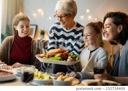 Family celebrating Thanksgiving Day 132738409