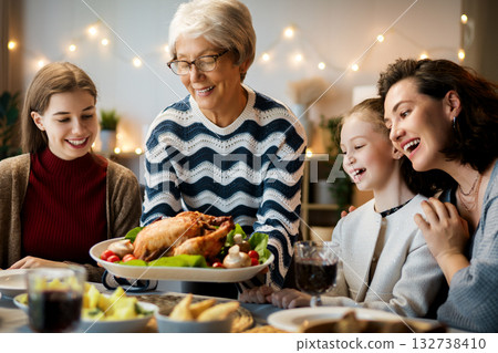 Family celebrating Thanksgiving Day 132738410