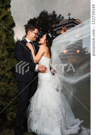 Interracial wedding couple embracing during special ceremony 132739149