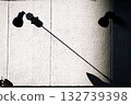 Wall lamp and long shadows Wall lamp and long shadows 132739398