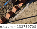 Brick-lined garden path — soil and shadow texture Brick-lined garden path — soil and shadow texture 132739708