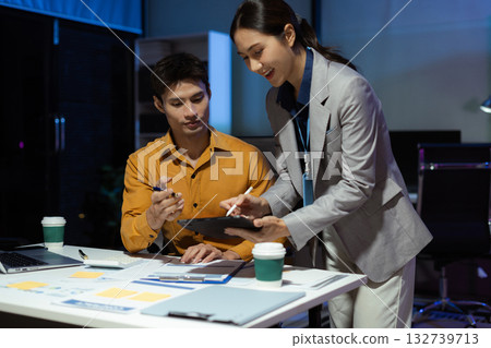 project manager working overtime on startup planning, updating progress milestones, and collaborating with investors for business success. 132739713