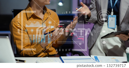 Businessman hand Project manager working overtime and update tasks and Gantt chart scheduling virtual diagram.with laptop in office. Businessman hand Project manager working overtime and update tasks and Gantt chart scheduling virtual diagram.with laptop in office. 132739717