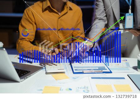 Business team analyzing financial data and planning projects in modern office. Business team analyzing financial data and planning projects in modern office. 132739718