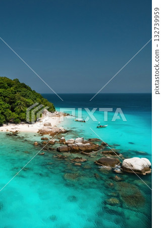 A bright beach with clear turquoise waters and lush greenery on a sunny day on the island of Lang Tengah in Malaysia A bright beach with clear turquoise waters and lush greenery on a sunny day on the island of Lang Tengah in Malaysia 132739959