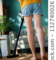 woman vacuuming floor 132740026