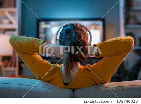 woman watching TV at home woman watching TV at home 132740029