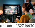 woman watching TV at home 132740030