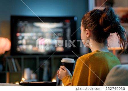 woman watching TV at home 132740030