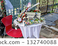 A piano and violin decorated with roses and a decorative table that gives off a musical vibe 132740088