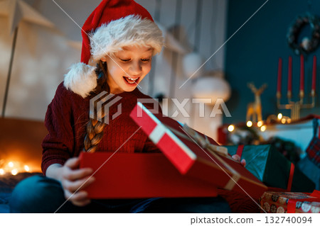 girl with Christmas gift girl with Christmas gift 132740094
