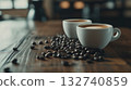 Coffee cups with latte art surrounded by roasted beans 132740859
