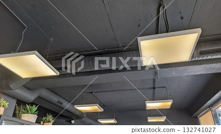 Explore the modern ceiling light fixtures that contribute to the stylish ambiance of a chic cafe Explore the modern ceiling light fixtures that contribute to the stylish ambiance of a chic cafe 132741027