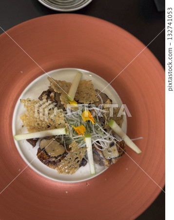 Gourmet Plated Dish with Edible Flowers and Garnish Gourmet Plated Dish with Edible Flowers and Garnish 132741053