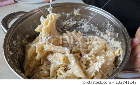 Delicious, creamy pasta dish perfectly made in a pot for everyone to enjoy together 132741142