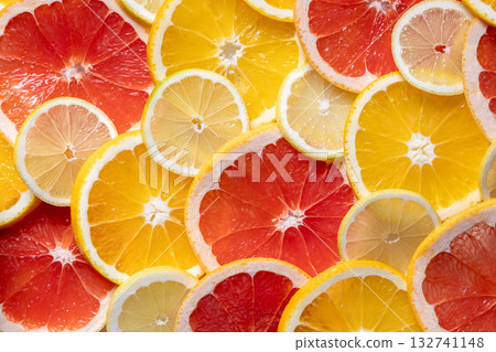 closeup of ripe juicy orange, grapefruit and lemon fruit slices 132741148