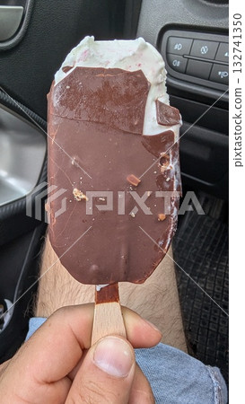 Indulge in a Delicious and Decadent Chocolate Coated Ice Cream Bar for the Ultimate Treat Indulge in a Delicious and Decadent Chocolate Coated Ice Cream Bar for the Ultimate Treat 132741350
