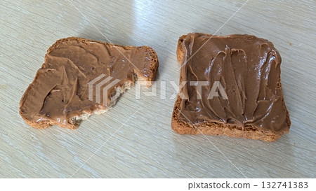 Spreadable Delights Enjoy the Tasty Combination of Peanut Butter on Fresh Bread Slices Spreadable Delights Enjoy the Tasty Combination of Peanut Butter on Fresh Bread Slices 132741383