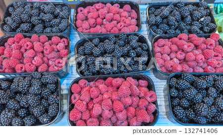 Discover the Delight of Fresh Raspberries and Blackberries Available at Your Local Market 132741406