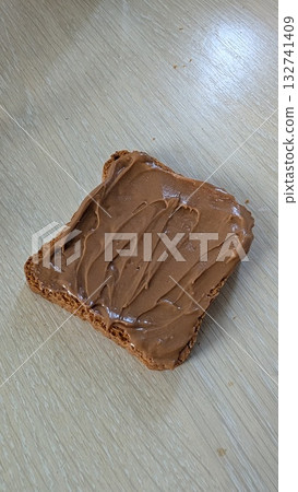 Indulge in the Delight of Spreading Creamy Peanut Butter Generously on Crispy Toast Indulge in the Delight of Spreading Creamy Peanut Butter Generously on Crispy Toast 132741409