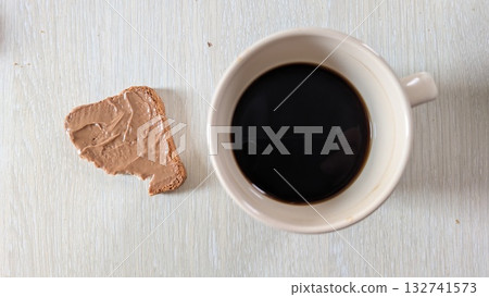 Enjoy the perfect Coffee and Biscuit Pairing displayed beautifully on a Rustic Table setting 132741573
