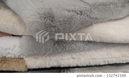 Cozy Textiles A Collection of Soft and Plush Blankets Expertly Stacked Together Cozy Textiles A Collection of Soft and Plush Blankets Expertly Stacked Together 132741589
