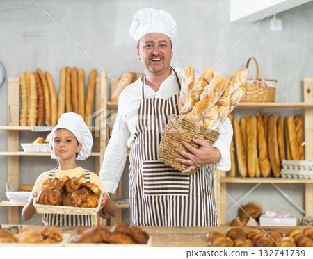 Father and little daughter selling bread and various baguettes for sale 132741739