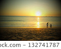 Brothers playing on sunset beach 132741787