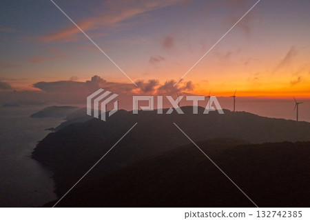 Sunset at Cape Sada and wind turbines 132742385