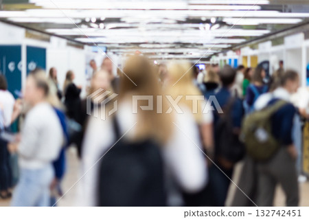 Abstract blurred people at exhibition hall of expo event trade show. Business convention show or job fair. Business concept background. 132742451