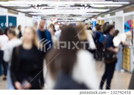 Abstract blurred people at exhibition hall of expo event trade show. Business convention show or job fair. Business concept background. Abstract blurred people at exhibition hall of expo event trade show. Business convention show or job fair. Business concept background. 132742458