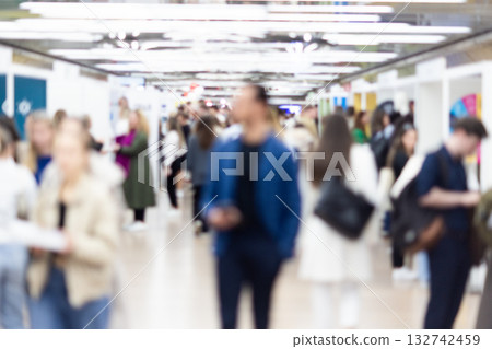 Abstract blurred people at exhibition hall of expo event trade show. Business convention show or job fair. Business concept background. Abstract blurred people at exhibition hall of expo event trade show. Business convention show or job fair. Business concept background. 132742459
