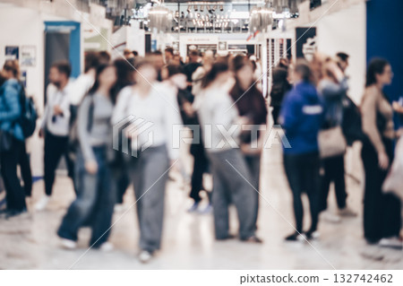 Abstract blurred people at exhibition hall of expo event trade show. Business convention show or job fair. Business concept background. 132742462