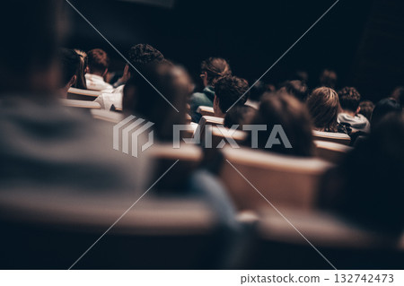 Rear view of unrecognizable people in audience at the conference hall. Business and entrepreneurship symposium 132742473