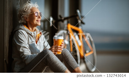 Elderly woman in sporty clothes with bike 132743014