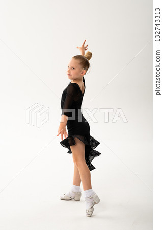 Smiling child in black ballroom outfit practicing elegant movement with hearing technology cochlear implant. Strength, inclusion, and artistic discipline harmonize to celebrate diversity and human Smiling child in black ballroom outfit practicing elegant movement with hearing technology cochlear implant. Strength, inclusion, and artistic discipline harmonize to celebrate diversity and human 132743313