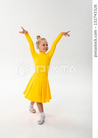 Young dancer with cochlear implant performing dance pose. Strength, adaptability, and inclusion merge in a story of overcoming hearing barriers through art, discipline, and body control. Young dancer with cochlear implant performing dance pose. Strength, adaptability, and inclusion merge in a story of overcoming hearing barriers through art, discipline, and body control. 132743326